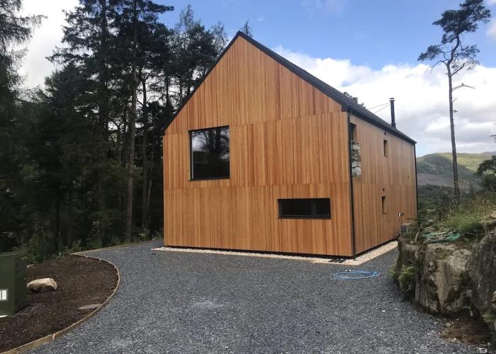 Red Stag With Stunning Loch and Waterfall View