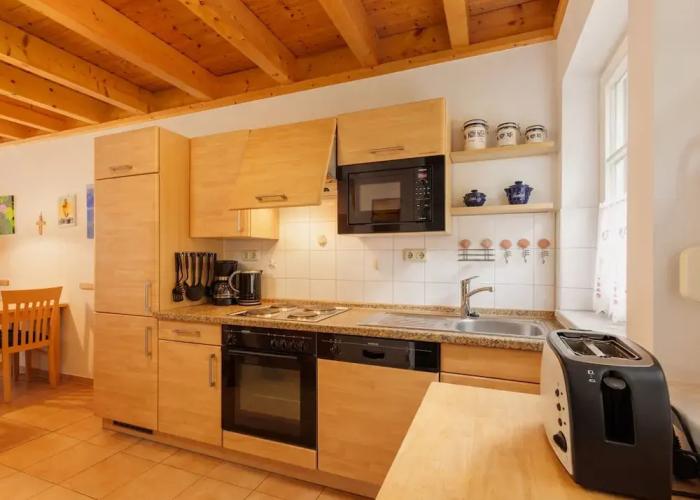 Cozy Holiday Home with Wood Burning Stove near Water