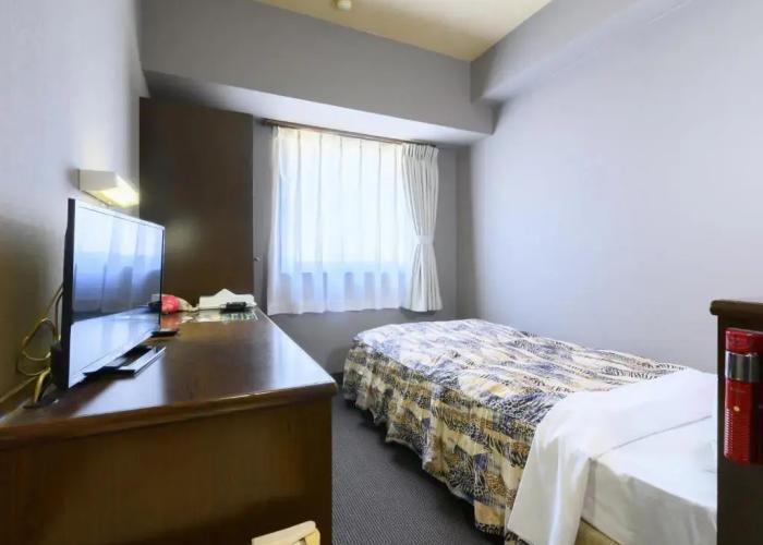 Tabist IWATA Station Hotel