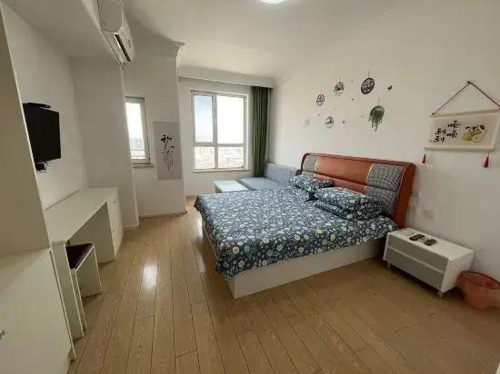 Happy Hour Seaview Apartment (Bayuquan Hongji Branch)