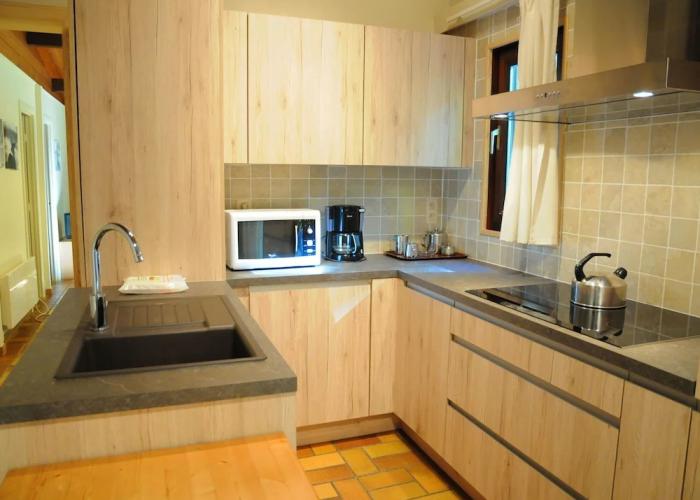 Wooden Chalet With Stove and Microwave Located in the Forest