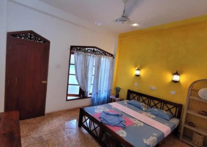 Malika's Yellow House