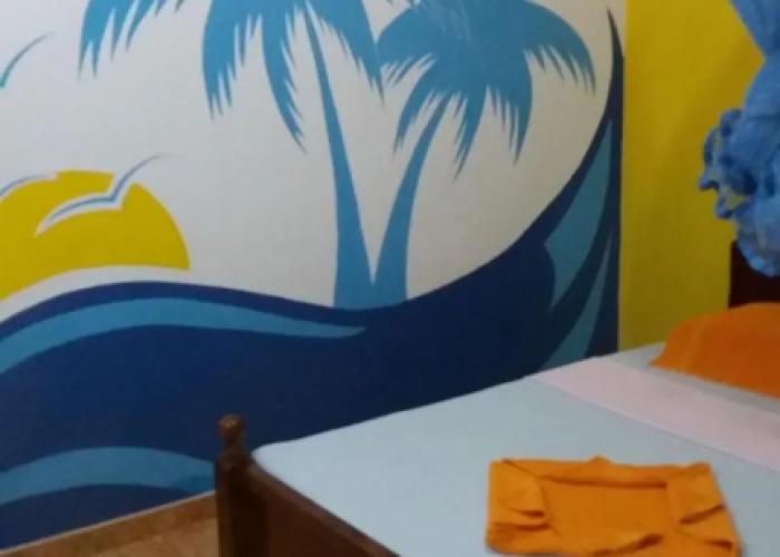 Malika's Yellow House