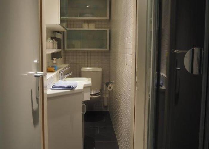 Bedroom cum office with shared shower in Zug's Old Town