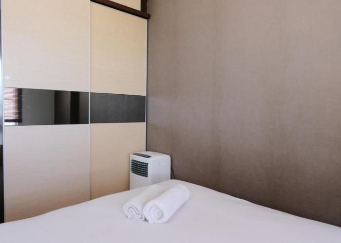 Spacious 3BR Combined Unit at Pinewood Apartment By Travelio