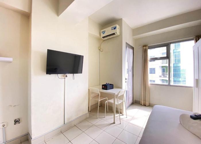 Homey Studio Room at Harvard Jatinangor Apartment By Travelio