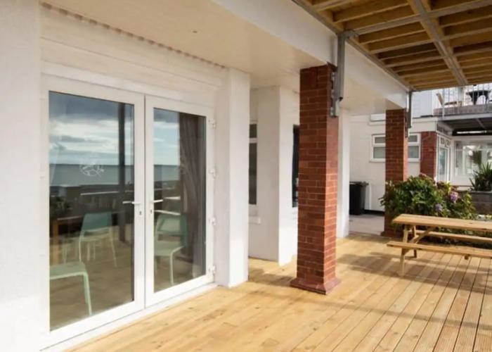 Absolute Beachfront With Decked Garden Oasis and Views